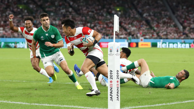 Super sub: Fukuoka crosses the try line to give Japan their first try.