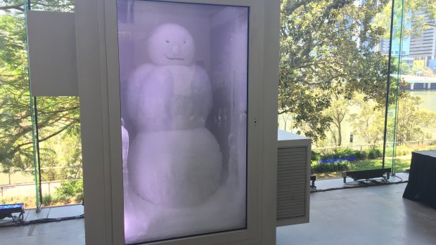 The snowman with the backdrop of the Queensland heatwave and Brisbane River.