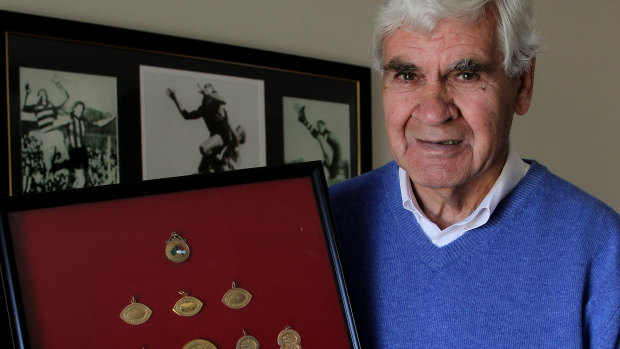 AFL great Graham 'Polly' Farmer at home in 2010 with his football medals. 