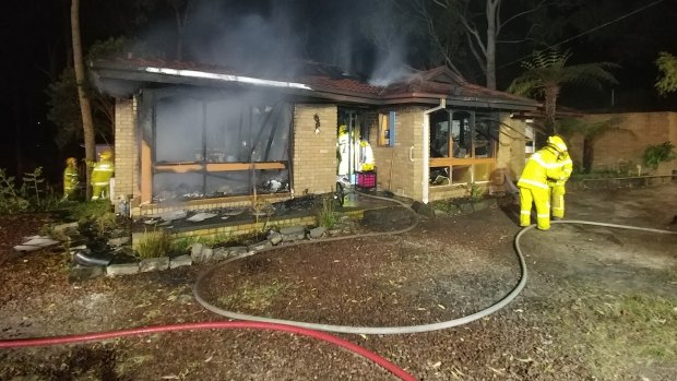 A teenage girl climbed out a window of a burning house in Victoria’s Dandenong Ranges.