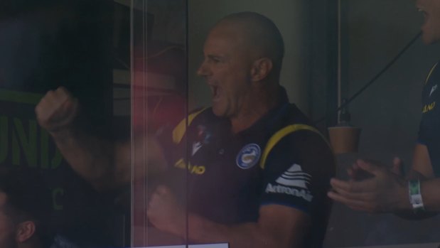 Brad Arthur pumps a fist after son Jakob scores on debut for Parramatta.