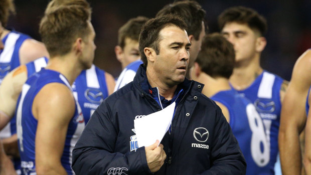 Frustrated fan: Kangaroos coach Brad Scott during the round 16 clash against the Suns at Etihad Stadium.