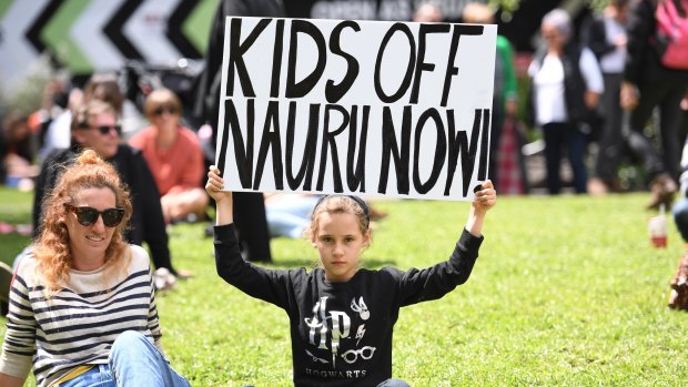 Scarlett Wright with her mother Elizabeth Hindmarsh during a rally at the steps of the State Library in Melbourne, on Saturday.