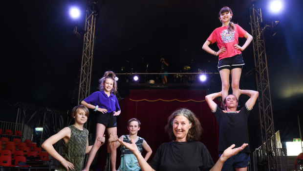 The Flying Fruit Fly Circus' artistic director Anni Davey with students (from left) Roscoe Harris-Westman, 14, Aysha Witt, 11, Nico Pope, 13 and Fidel Lancaster-Cole, 15, with Nell Finch, 14, on shoulders. 