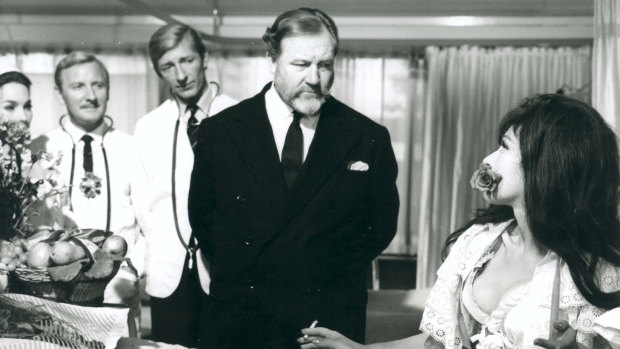 Doctor in Clover (1966) Leslie  Phillips (left), Jeremy Lloyd and James Robertson Justice and Fenella Fielding.