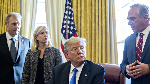 In January, David Shulkin, then-US secretary of Veterans Affairs, right, speaks as US President Donald Trump, centre, and Kirstjen Nielsen, secretary of Homeland Security, second left, listen.