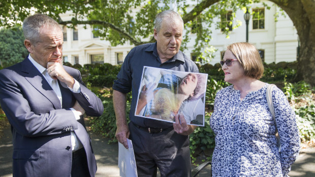 Opposition Leader Bill Shorten with Peter and Paula Curotte, whose son, Alexander, was injured while in the care of Victoria's Department of Human Services.