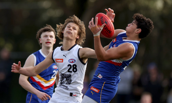 Tall defender Cooper Trembath (right) is among the mid-season draft contenders.