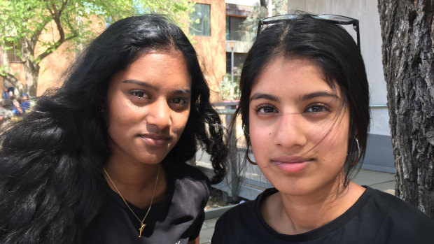 Students Sinali Hapu Arachchige, left, and Apoorva Sajja of Narrabundah College, who have different views from their mothers.