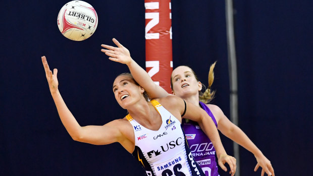 Caitlin Bassett (left) of the Lightning in action against Tara Hinchliffe of the Firebirds during their round 2 Super Netball match at the Brisbane Entertainment Centre on Sunday.