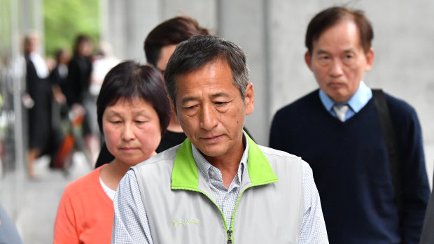 The family and friends of victim Jei "Jack" Lee are seen leaving the Supreme Court in Brisbane.