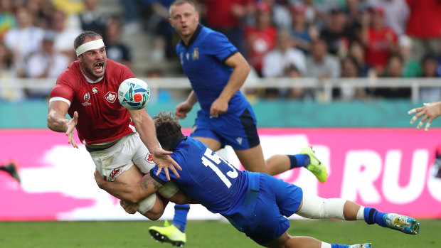 Tyler Ardron of Canada is tackled by Matteo Minozzi of Italy.