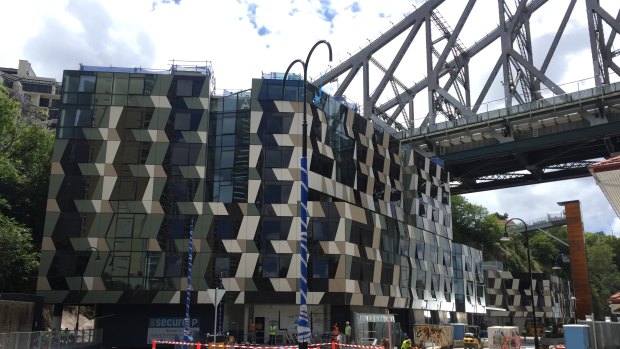 New five-star hotel looks like a deck of playing cards under the Story Bridge. It opens in March 2019.