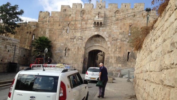My father (right) approaching St Stephen's Gate, also known as the Lions' Gate, one of the entrances to Jerusalem's Old City in the occupied east of the capital.