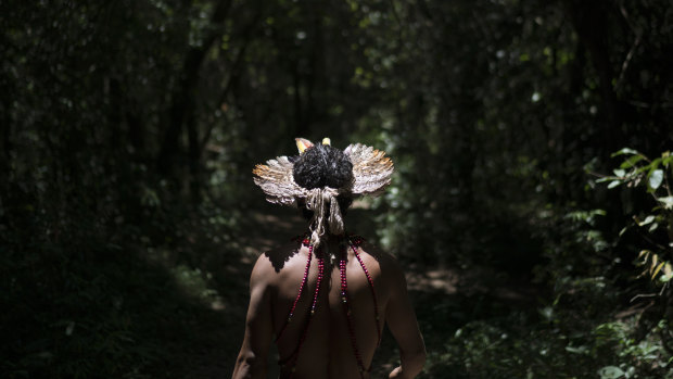 Hayo, chief of the Pataxo Ha-ha-hae indigenous community, walks toward the Paraopeba River days after the collapse of a mining company dam near his village in Brumadinho, Brazil.