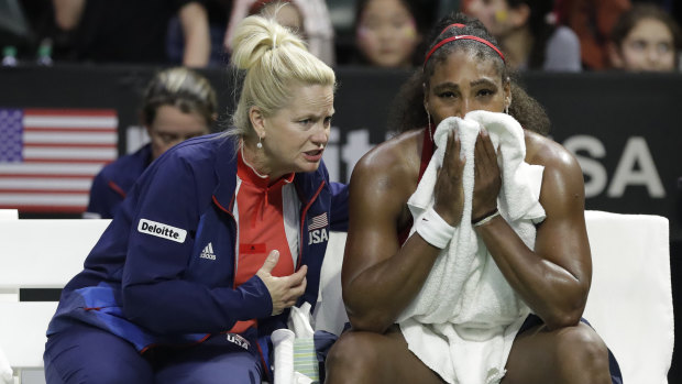 Pep talk: United States' captain Kathy Rinaldi counsels Serena Williams during a break in the match.