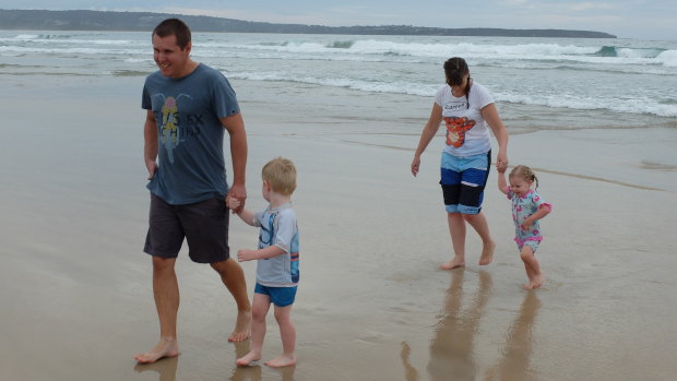 Toby Jamieson (left) at the beach with his son William, wife Linda and daughter Sophie in 2016.
