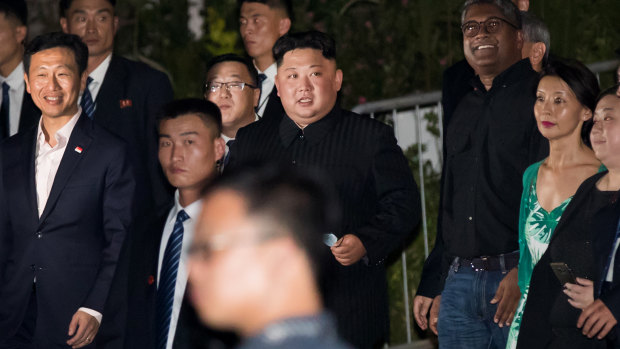 Kim Jong-un tours the Esplanade in Singapore on Monday night.