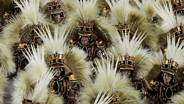 Samba school dancers parade during Carnival celebrations at the Sambadrome in Rio de Janeiro, Brazil.