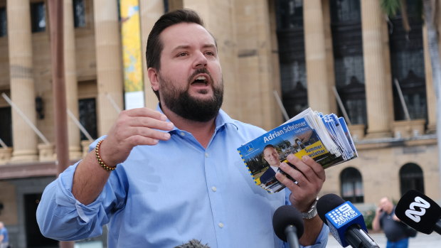 Jared Cassidy speaks to journalists outside City Hall.