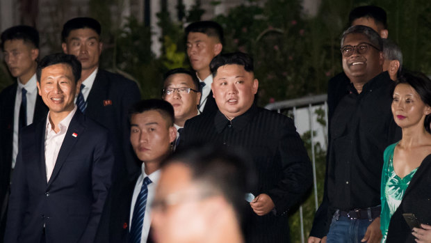 Kim Jong-un tours the Esplanade in Singapore on Monday night.