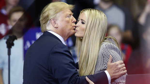 President Donald Trump kisses his daughter Ivanka during a rally in Fort Wayne, Indiana.