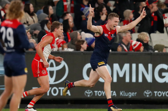 Tom McDonald celebrates one of his four goals for the Demons in their win over the Swans.
