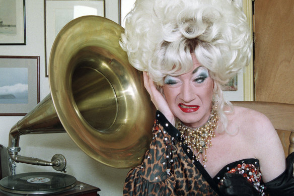 Paul O’Grady dressed as Lily Savage poses for a photo at home in south London, 1993. 