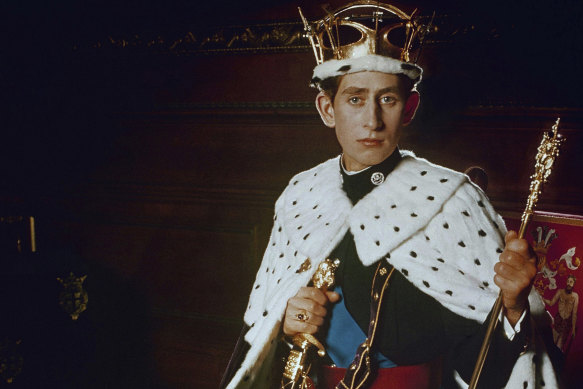 In this 1969 file photo, Britain’s Prince Charles, poses for a photo dressed in his investiture regalia as Prince of Wales.  