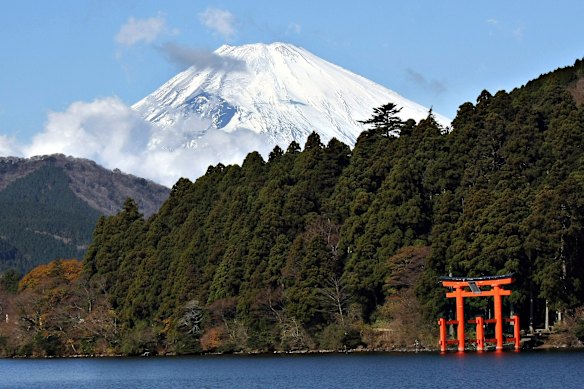 Mount Fuji looms above Lake Ashi.