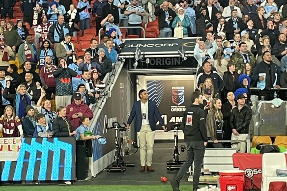 Haumole Olakau’atu watches the NSW players celebrate after being banned from the playing field