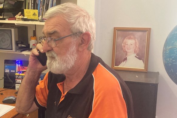 Lyndon Pelly with a photograph of his daughter Midshipman Megan Pelly, who died in the fire on the HMAS Westralia.