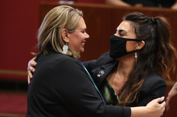 Dorinda Cox is congratulated by Senator Lidia Thorpe after delivering her first speech to the Senate in  October 2021.