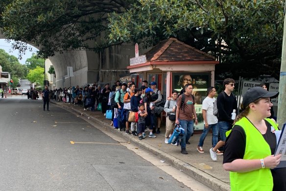 Partygoers queue to access Milsons Point on Sunday morning.