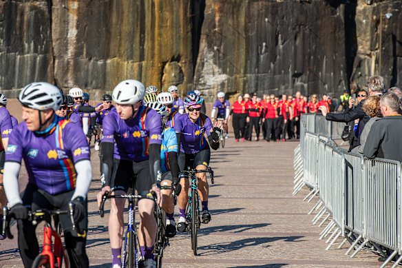 The peloton arrives at the Opera House to honour Scolyer’s efforts to raise funds for cancer reserach.