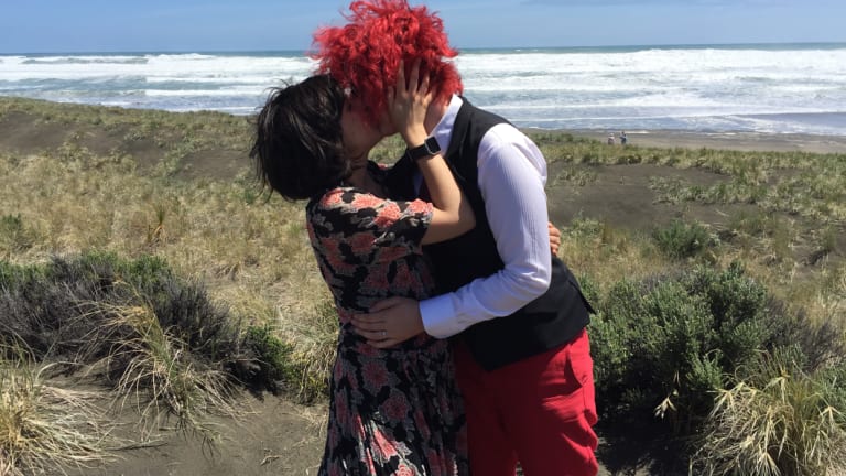 Alice Clarke (right) with her wife, Karma Clarke, on their wedding day.