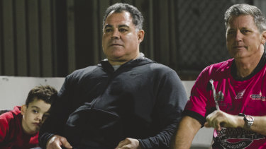 Mal Meninga and Bill Harrigan look on.