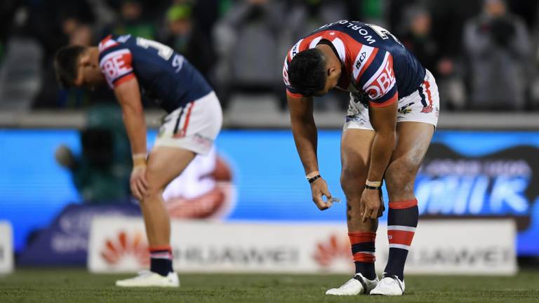 Has anyone seen our form? Dejected Roosters players after losing to Canberra. 