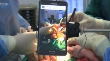 A phone on a selfie stick helped Dr Nott teach the surgery online.
