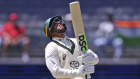Australia’s Usman Khawaja reacts after losing his wicket to India’s Mohammed Siraj on the fourth day.