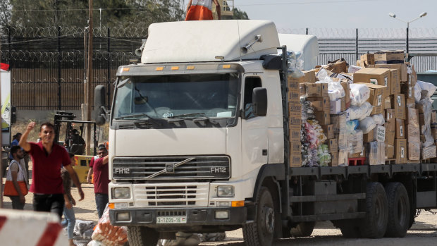 First emergency aid trucks roll into Gaza after overnight Israeli air strikes