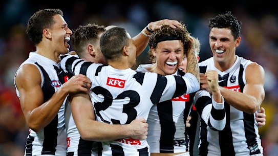 Collingwood celebrate a goal.