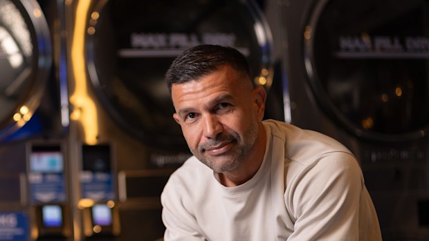 Omer Tas, founder of Sydney laundromat chain Stacks Laundry, in the Harris Park store.