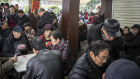 Elderly people play card games at a tea house in Wenzhou, China. 