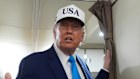 President Donald Trump speaks to reporters on board Air Force One.