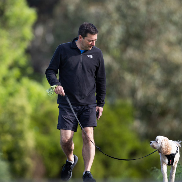 Matthew Guy walks his dog Wally.
