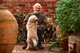 Moss Cass at home in Melbourne with his dog Milka in 2002.  
