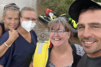 Prominent conspiracy theorist David Oneeglio takes a selfie with flood victims.