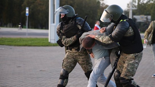 Riot police detain a protester during an opposition rally to protest the presidential inauguration in Minsk, Belarus.
