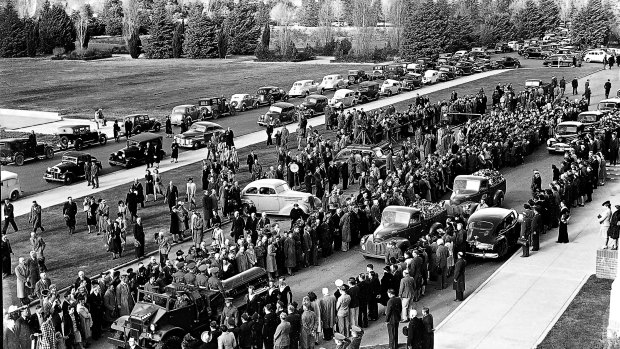 A day of solemn ceremony... Memorial service in Canberra for Prime Minister John Curtin on July 6, 1945.